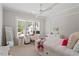 Bright bedroom featuring a modern bed frame, neutral decor, and large windows at 5803 Vintage Oak Ln, Raleigh, NC 27613