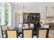 A dining room featuring a chandelier, dark wood table, and built-in china cabinet with decor at 5803 Vintage Oak Ln, Raleigh, NC 27613