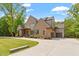 Beautiful brick home featuring professionally landscaped yard and a curved driveway at 5803 Vintage Oak Ln, Raleigh, NC 27613