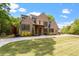 Stunning brick home featuring professionally landscaped front yard and a symmetrical front elevation at 5803 Vintage Oak Ln, Raleigh, NC 27613