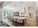 Open-concept kitchen with large island, stainless steel appliances, and a breakfast nook at 5803 Vintage Oak Ln, Raleigh, NC 27613