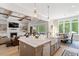 Bright kitchen with a large island, stainless appliances, and seamless flow to living spaces at 5803 Vintage Oak Ln, Raleigh, NC 27613