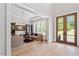 Bright living room with hardwood floors, recessed lights, neutral paint, and large windows at 5803 Vintage Oak Ln, Raleigh, NC 27613