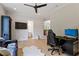 Comfortable living room with a ceiling fan, television, and hardwood floors at 5803 Vintage Oak Ln, Raleigh, NC 27613