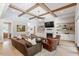 Spacious living room featuring a coffered ceiling, fireplace, and stylish decor at 5803 Vintage Oak Ln, Raleigh, NC 27613