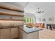 Stylish wet bar features a concrete countertop, floating wood shelves, mosaic backsplash, and plenty of counterspace at 5803 Vintage Oak Ln, Raleigh, NC 27613