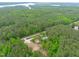 A beautiful view showing the property with trees, landscaping, and nearby waterfront access at 615 Beaver Creek Rd, Apex, NC 27502