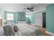 Inviting bedroom with blue walls, hardwood floors, and bright natural light at 615 Beaver Creek Rd, Apex, NC 27502