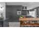 Eat-in kitchen featuring stainless steel oven set in black painted brick wall at 615 Beaver Creek Rd, Apex, NC 27502