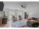 Bright living room with hardwood floors, comfortable seating, and a decorative fireplace at 615 Beaver Creek Rd, Apex, NC 27502