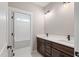 Bathroom with double sink vanity, granite countertop, modern fixtures, and view of subway tile shower at 6185 Nc-50, Benson, NC 27504