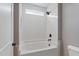 Bathroom with tiled shower, including a shower head, and handheld shower faucet at 6185 Nc-50, Benson, NC 27504
