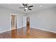 Spacious bedroom featuring hardwood floors and access to walk in closet and bathroom at 6185 Nc-50, Benson, NC 27504