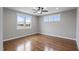 Cozy bedroom featuring a ceiling fan and windows offering serene views of the lake at 6185 Nc-50, Benson, NC 27504