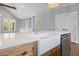 Farmhouse sink with stainless dishwasher, custom cabinetry, and luxurious counters at 6185 Nc-50, Benson, NC 27504