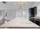 Spacious kitchen island with sink, modern appliances, and sleek countertops at 6185 Nc-50, Benson, NC 27504