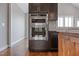 Built-in ovens with dark stained cabinets and lighter colored counters at 6185 Nc-50, Benson, NC 27504