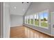 Bright living room featuring hardwood floors and large windows with a view of the outdoors at 6185 Nc-50, Benson, NC 27504