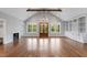 Spacious room with fireplace, hardwood floors, modern lighting and built-in shelving; perfect for gathering at 6185 Nc-50, Benson, NC 27504