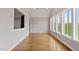 Bright living room with hardwood floors, large windows, and views of lush greenery at 6185 Nc-50, Benson, NC 27504
