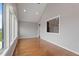Bright living room with hardwood floors, large windows, and views of lush greenery at 6185 Nc-50, Benson, NC 27504