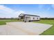 This metal outbuilding has a gravel driveway and side shelter; perfect for extra parking or storage at 6185 Nc-50, Benson, NC 27504