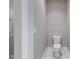 Simple powder room featuring hexagon marble-patterned tiles and a standard toilet at 6185 Nc-50, Benson, NC 27504