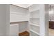 Organized walk-in closet with ample shelving and hanging space, and adjacent to a bathroom at 6185 Nc-50, Benson, NC 27504