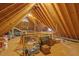 Unfinished attic shows wooden beams, ducts, and some storage items at 6245 Hampton Ridge Rd, Raleigh, NC 27603