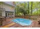 Exterior backyard view featuring a pool, deck and patio seating at 6245 Hampton Ridge Rd, Raleigh, NC 27603