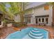 Home's exterior with a deck, pool, patio seating and landscaped surroundings at 6245 Hampton Ridge Rd, Raleigh, NC 27603