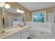 Spacious bathroom featuring double vanity, a soaking tub, and a walk-in shower at 6245 Hampton Ridge Rd, Raleigh, NC 27603