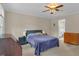 Bedroom featuring a ceiling fan, neutral walls, and classic decor at 6245 Hampton Ridge Rd, Raleigh, NC 27603
