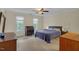Bedroom featuring a ceiling fan, neutral walls, and classic decor at 6245 Hampton Ridge Rd, Raleigh, NC 27603