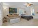 Large bedroom showcases windows, a sofa, and neutral carpeting and colors at 6245 Hampton Ridge Rd, Raleigh, NC 27603