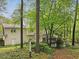 Exterior of the home with a gazebo, lush trees and shrubs at 6245 Hampton Ridge Rd, Raleigh, NC 27603