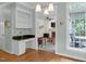 Open living space with hardwood floors, built-in shelves, and desk at 6245 Hampton Ridge Rd, Raleigh, NC 27603