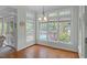 Bright sunroom with hardwood floors, large windows, and views of the pool at 6245 Hampton Ridge Rd, Raleigh, NC 27603