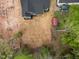 Bird's-eye view of a home showing the layout of the property, tree coverage, and surrounding land at 648 Shawnee Dr, Louisburg, NC 27549