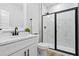 Bathroom with a marble walk-in shower, vanity and sink at 648 Shawnee Dr, Louisburg, NC 27549