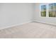 Bedroom with natural light and carpet floors at 648 Shawnee Dr, Louisburg, NC 27549