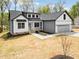 Beautiful two-story home boasting stylish curb appeal with modern design elements and attached two-car garage at 648 Shawnee Dr, Louisburg, NC 27549