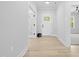 Bright foyer with a glass-paneled front door and an adjacent study room at 648 Shawnee Dr, Louisburg, NC 27549