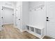 The hallway features wood floors, white trim and wainscotting, and convenient storage at 648 Shawnee Dr, Louisburg, NC 27549