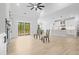 Spacious living room with hardwood floors, a fireplace, and a sliding glass door to the patio at 648 Shawnee Dr, Louisburg, NC 27549