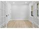 The office has wood floors, a bright window, and doors allowing natural light to fill the room at 648 Shawnee Dr, Louisburg, NC 27549