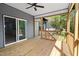 This screened porch includes a ceiling fan and provides a relaxing outdoor space at 648 Shawnee Dr, Louisburg, NC 27549