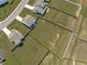 An aerial view features a spacious, green backyard in a community neighborhood at 76 Arlie Ln, Lillington, NC 27546