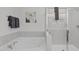 Clean bathroom with a soaking tub and separate shower at 76 Arlie Ln, Lillington, NC 27546