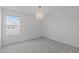 Carpeted bedroom featuring a window with a view of the neighborhood at 76 Arlie Ln, Lillington, NC 27546